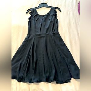 Express black rayon style mini dress.Size 2. Flutter sleeve, lace back.